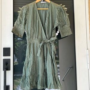 Karina Grimaldi green mini dress.